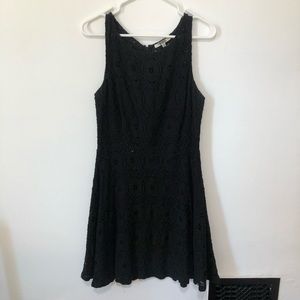 Sleeveless black lace dress. Zipper in back. 10